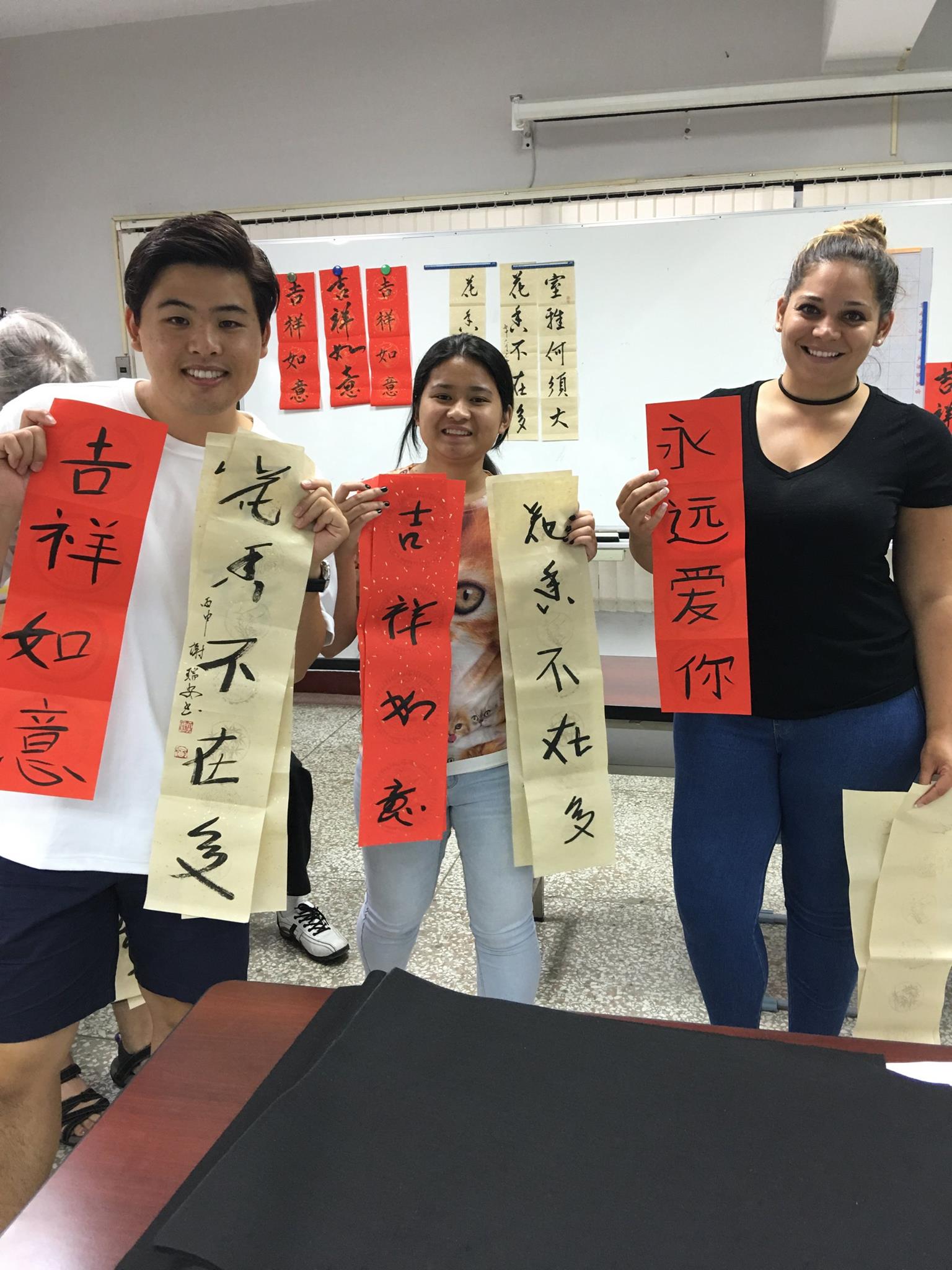 Taiwan students holding scrolls